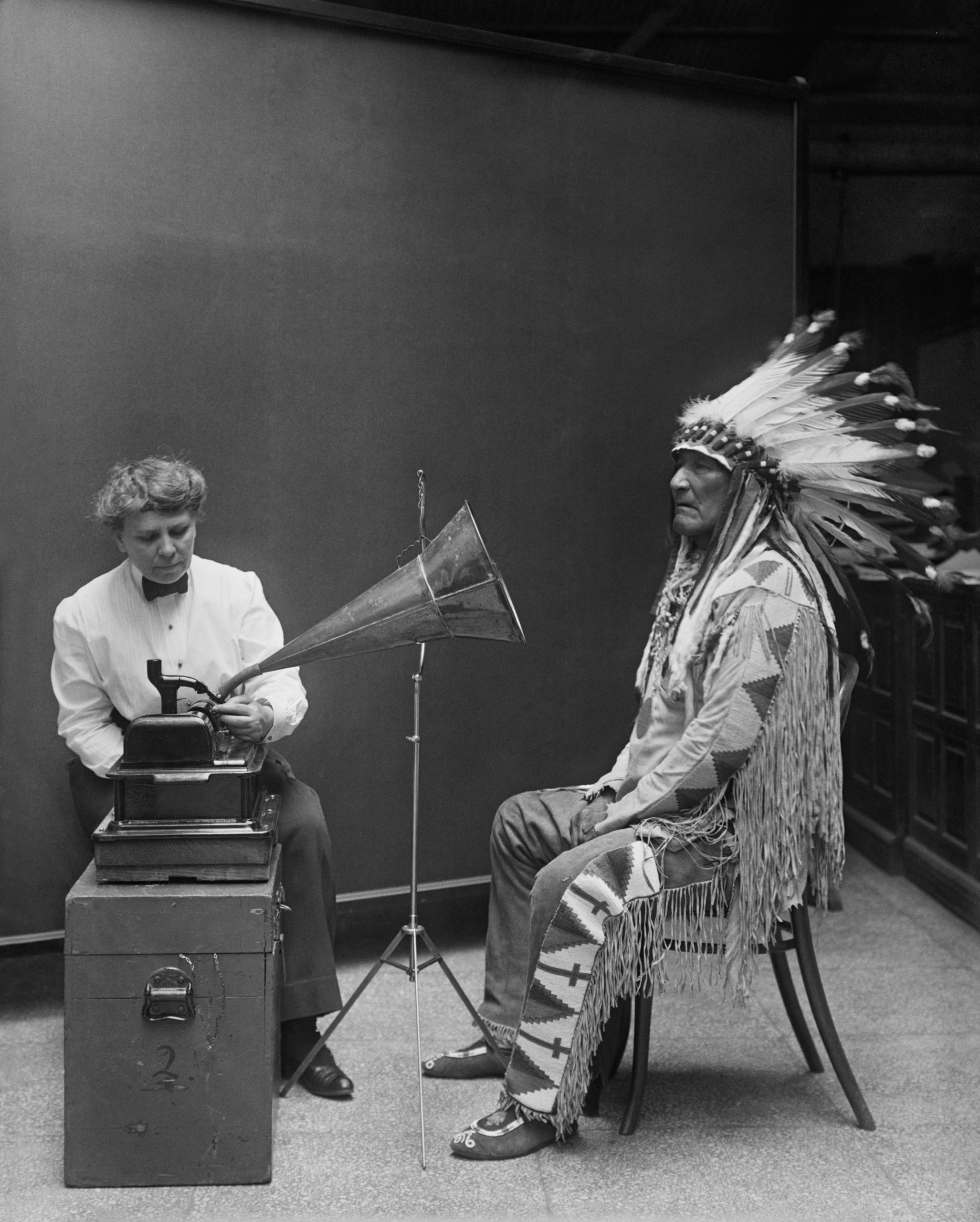 Frances Densmore and Mountain Chief with an early sound recording device in 1916